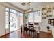 Bright dining area with sliding door access to the backyard patio and a view of the pergola at 10645 Lace Vine Arbor Ave, Las Vegas, NV 89144