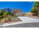 Charming two-story home featuring a well-maintained yard with mature landscaping, a concrete driveway, and an attached two-car garage at 10645 Lace Vine Arbor Ave, Las Vegas, NV 89144
