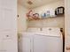 Functional laundry room with modern appliances and plenty of storage space, perfect for organization at 10645 Lace Vine Arbor Ave, Las Vegas, NV 89144