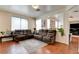 Spacious living room with wood floors, neutral walls, recessed lighting, and an open layout to other living spaces at 10645 Lace Vine Arbor Ave, Las Vegas, NV 89144