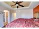 Spacious main bedroom featuring unique ceiling design, ceiling fan and ensuite access at 10645 Lace Vine Arbor Ave, Las Vegas, NV 89144