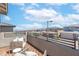 Cozy balcony with stylish seating offers neighborhood views on a sunny day at 11756 Emerald Lake Ave, Las Vegas, NV 89138