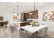 Kitchen features stainless steel appliances, a center island, and stylish pendant lighting at 11756 Emerald Lake Ave, Las Vegas, NV 89138