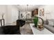 Stylish open concept living area with modern decor, seating, and connection to the kitchen at 11756 Emerald Lake Ave, Las Vegas, NV 89138