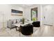 Comfortable living room features a large window, couch, and decor at 11756 Emerald Lake Ave, Las Vegas, NV 89138