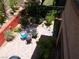 Charming backyard with brick-paved patio, outdoor furniture, and lush landscaping, perfect for relaxing at 11832 Arenoso Dr, Las Vegas, NV 89138