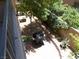 Outdoor patio features lush landscaping, a barbecue, and a brick-paved area at 11832 Arenoso Dr, Las Vegas, NV 89138