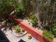 Picturesque backyard featuring decorative stonework, colorful flowers, and mature trees for a serene escape at 11832 Arenoso Dr, Las Vegas, NV 89138