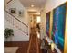 Entryway of a home with staircase, hardwood floors, and hallway to other rooms at 11832 Arenoso Dr, Las Vegas, NV 89138