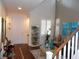 Inviting entryway showcasing hardwood floors, high ceilings, and a staircase to the second floor at 11832 Arenoso Dr, Las Vegas, NV 89138