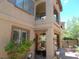 Exterior view of a two-story home with a balcony and covered patio at 11832 Arenoso Dr, Las Vegas, NV 89138