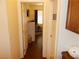 Bright hallway leading to a cozy office space with natural light and a comfortable workspace at 11832 Arenoso Dr, Las Vegas, NV 89138