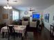 Bright living room showcases a fireplace, dark floors, and natural light at 11832 Arenoso Dr, Las Vegas, NV 89138