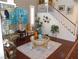 Living room with hardwood floors, bright natural light, and stairway to the second floor at 11832 Arenoso Dr, Las Vegas, NV 89138