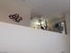 Open loft space with a view, featuring a ceiling fan and stylish decor accents at 11832 Arenoso Dr, Las Vegas, NV 89138