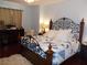 Comfortable main bedroom featuring a decorative iron bed frame and ample closet space at 11832 Arenoso Dr, Las Vegas, NV 89138
