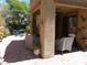 Covered patio features an outdoor seating area with desert landscaping in the backyard at 11832 Arenoso Dr, Las Vegas, NV 89138