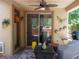 Inviting covered patio featuring a ceiling fan, stylish decor, and cozy seating area at 11832 Arenoso Dr, Las Vegas, NV 89138