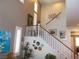 Entry staircase featuring hardwood floors and white railings at 11832 Arenoso Dr, Las Vegas, NV 89138