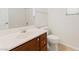 Well-lit bathroom featuring a vanity with a sink, toilet and tile flooring at 11900 Calle De Sol Dr, Las Vegas, NV 89138