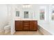Bathroom featuring double vanity, soaking tub, and toilet at 11900 Calle De Sol Dr, Las Vegas, NV 89138