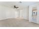 Open bedroom with doors leading to other rooms and to the outside at 11900 Calle De Sol Dr, Las Vegas, NV 89138