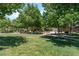 Community park with lush greenery, a playground, picnic tables and benches, perfect for outdoor enjoyment at 11900 Calle De Sol Dr, Las Vegas, NV 89138