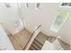 Hallway with stairs, white railings and multiple windows at 11900 Calle De Sol Dr, Las Vegas, NV 89138