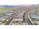 Stunning aerial view of a neighborhood, nestled in a desert landscape with mountain views at 12382 Tudor Arch Dr, Las Vegas, NV 89138