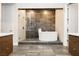 This modern bathroom features a soaking tub and walk-in glass shower at 12382 Tudor Arch Dr, Las Vegas, NV 89138