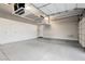 Spacious garage featuring ample storage cabinets and an organized overhead rack system at 12382 Tudor Arch Dr, Las Vegas, NV 89138