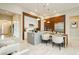 Open-concept kitchen boasts an island with seating, modern cabinetry, and plenty of natural light at 12382 Tudor Arch Dr, Las Vegas, NV 89138