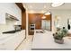 Contemporary kitchen with stainless steel appliances, quartz countertops, and sleek white cabinets at 12382 Tudor Arch Dr, Las Vegas, NV 89138