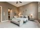 Relaxing main bedroom showcasing neutral tones, carpeted floors, and a cozy seating area at 12382 Tudor Arch Dr, Las Vegas, NV 89138