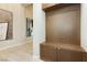 Inviting mudroom with custom wood storage bench and cabinets at 12382 Tudor Arch Dr, Las Vegas, NV 89138