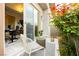 Cozy patio with outdoor seating adjacent to home office at 12382 Tudor Arch Dr, Las Vegas, NV 89138