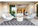 Cozy patio with modern furniture, seamlessly connected to the open-concept living space, creating a relaxed atmosphere at 12382 Tudor Arch Dr, Las Vegas, NV 89138