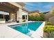 Sparkling backyard pool with clean design, surrounded by lush landscaping for a private oasis at 12382 Tudor Arch Dr, Las Vegas, NV 89138