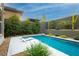 Beautiful pool surrounded by desert landscaping, offering a tranquil retreat at 12382 Tudor Arch Dr, Las Vegas, NV 89138