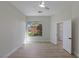 Bright bedroom features a ceiling fan, wood floors, and a window with natural light and view at 17 Winding Rd, Henderson, NV 89052