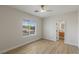 Bedroom featuring wood flooring, large window, and ensuite bathroom at 17 Winding Rd, Henderson, NV 89052