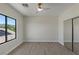 Bedroom featuring a large window, vinyl flooring, and a ceiling fan at 17 Winding Rd, Henderson, NV 89052
