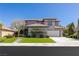 Attractive two-story home with well-maintained lawn, mature trees, and appealing architectural style at 17 Winding Rd, Henderson, NV 89052