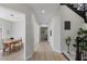 Bright foyer featuring modern lighting and staircase with decorative plants for a welcoming ambiance at 17 Winding Rd, Henderson, NV 89052