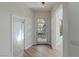 Bright, modern foyer with a stylish front door and natural light, creating a welcoming entry at 17 Winding Rd, Henderson, NV 89052