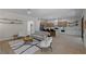 Bright, modern living room open to the kitchen featuring hardwood floors at 17 Winding Rd, Henderson, NV 89052