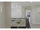 A bright staircase with an ornate chandelier hanging from the second floor at 17 Winding Rd, Henderson, NV 89052