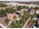 Aerial view of neighborhood featuring tile roofs, solar panels, palm trees, and desert landscaping at 1839 Thunder Mountain Dr, Henderson, NV 89012