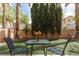 Charming backyard with artificial turf, desert landscaping, and covered patio at 1839 Thunder Mountain Dr, Henderson, NV 89012