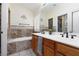 Bathroom with double sinks, large mirror, and tiled tub at 1839 Thunder Mountain Dr, Henderson, NV 89012